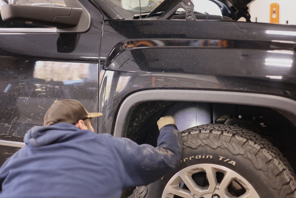 Winter Tires, Tire Services in West Point, VA At Eltham Auto Clinic. Mechanic inspecting a vehicle tire for tire service.